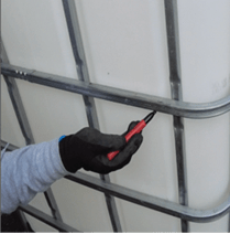 Marking a line around the plastic container of IBC.