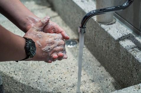 A person washing hands