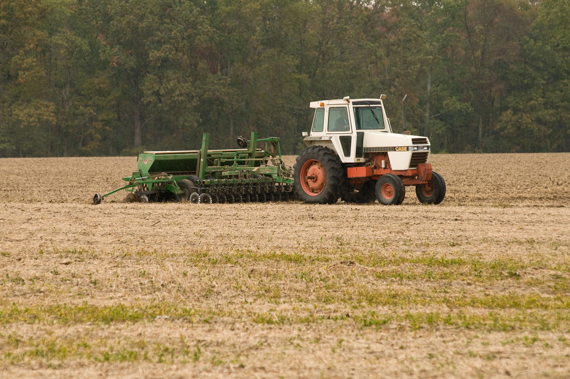 machinery moving across grain farm