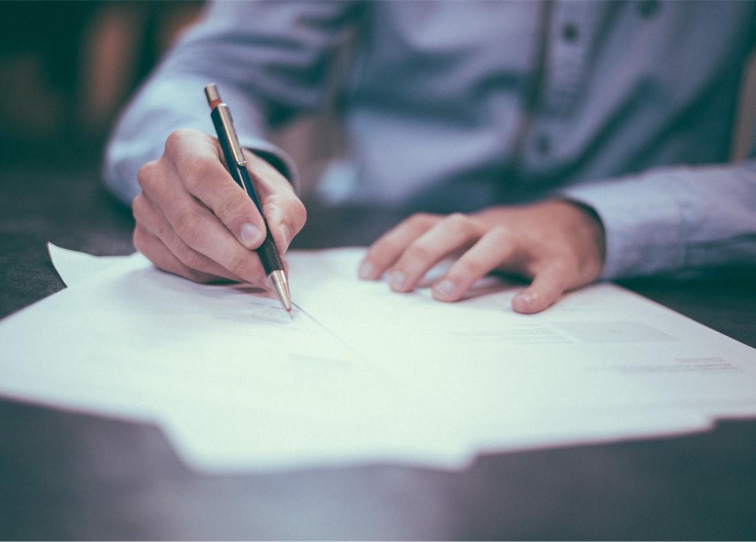 Man filling out paperwork