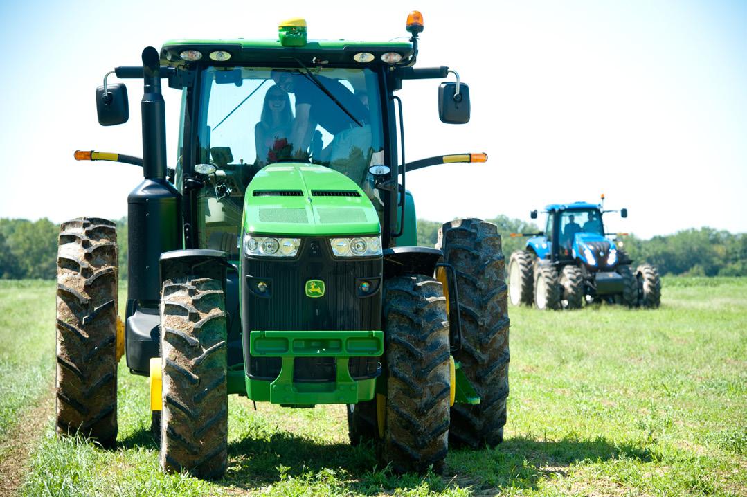 Women driving tractor and another tractor in the background. Photo:Edwin Remsberg