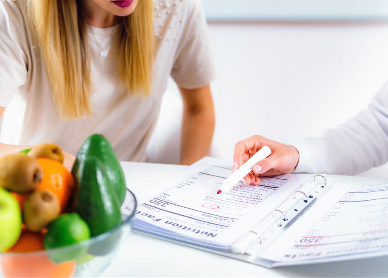 Nutritionist with female patient