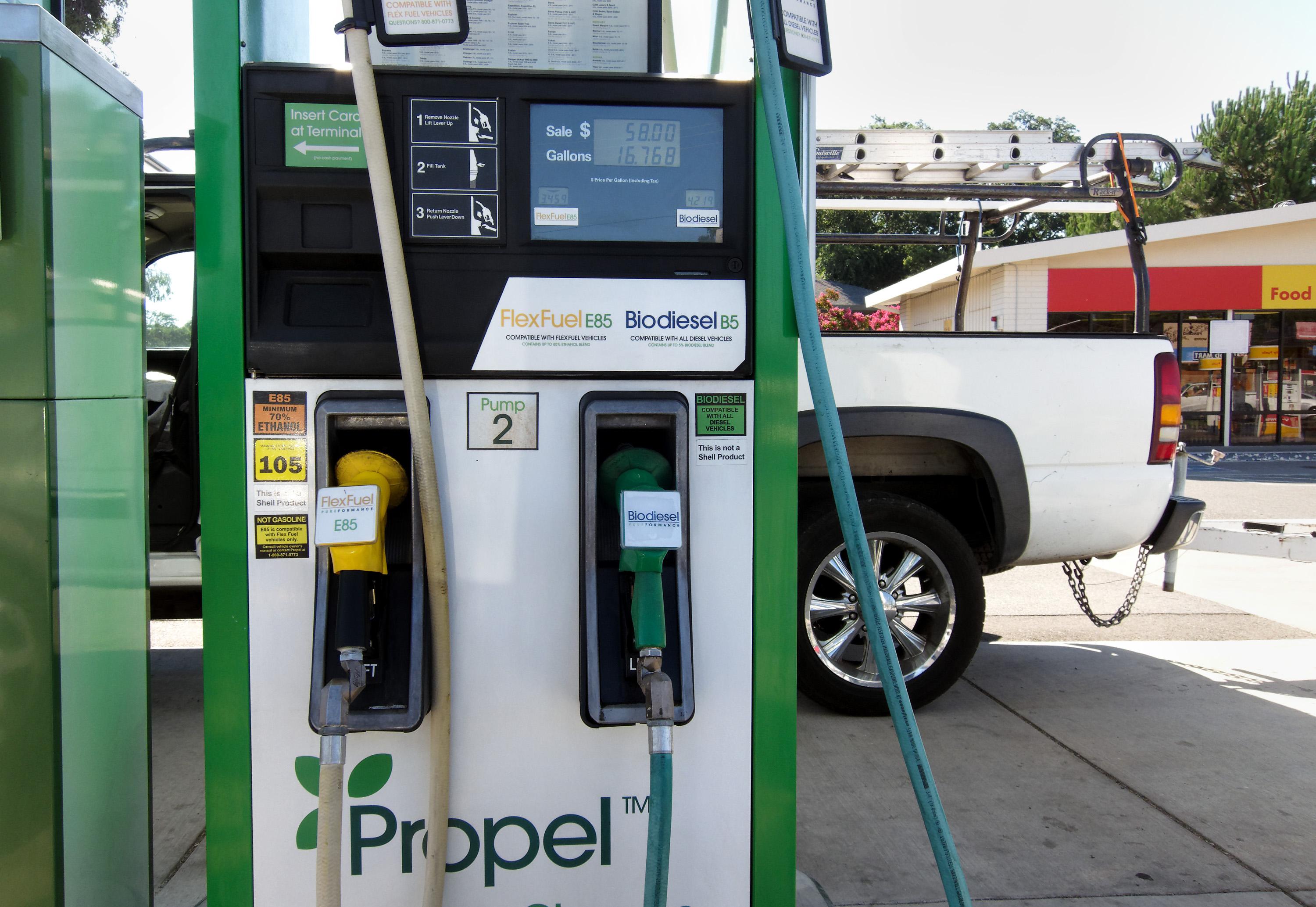 a biofuel gas pump in front of a truck and station