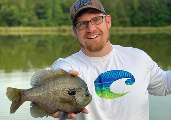 Image of Allen Pattillo holding a fish