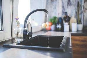 Kitchen sink, faucet running