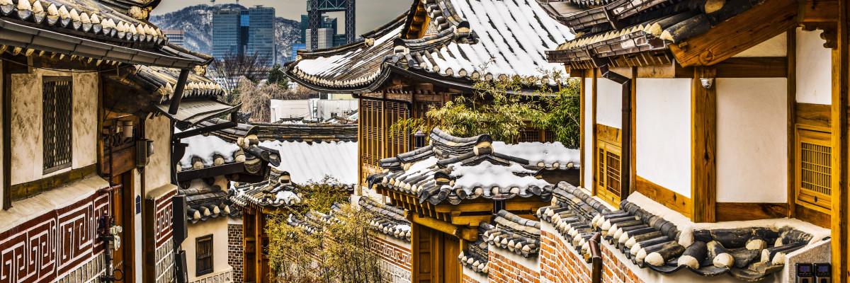 mountain in background Korean buildings in foreground