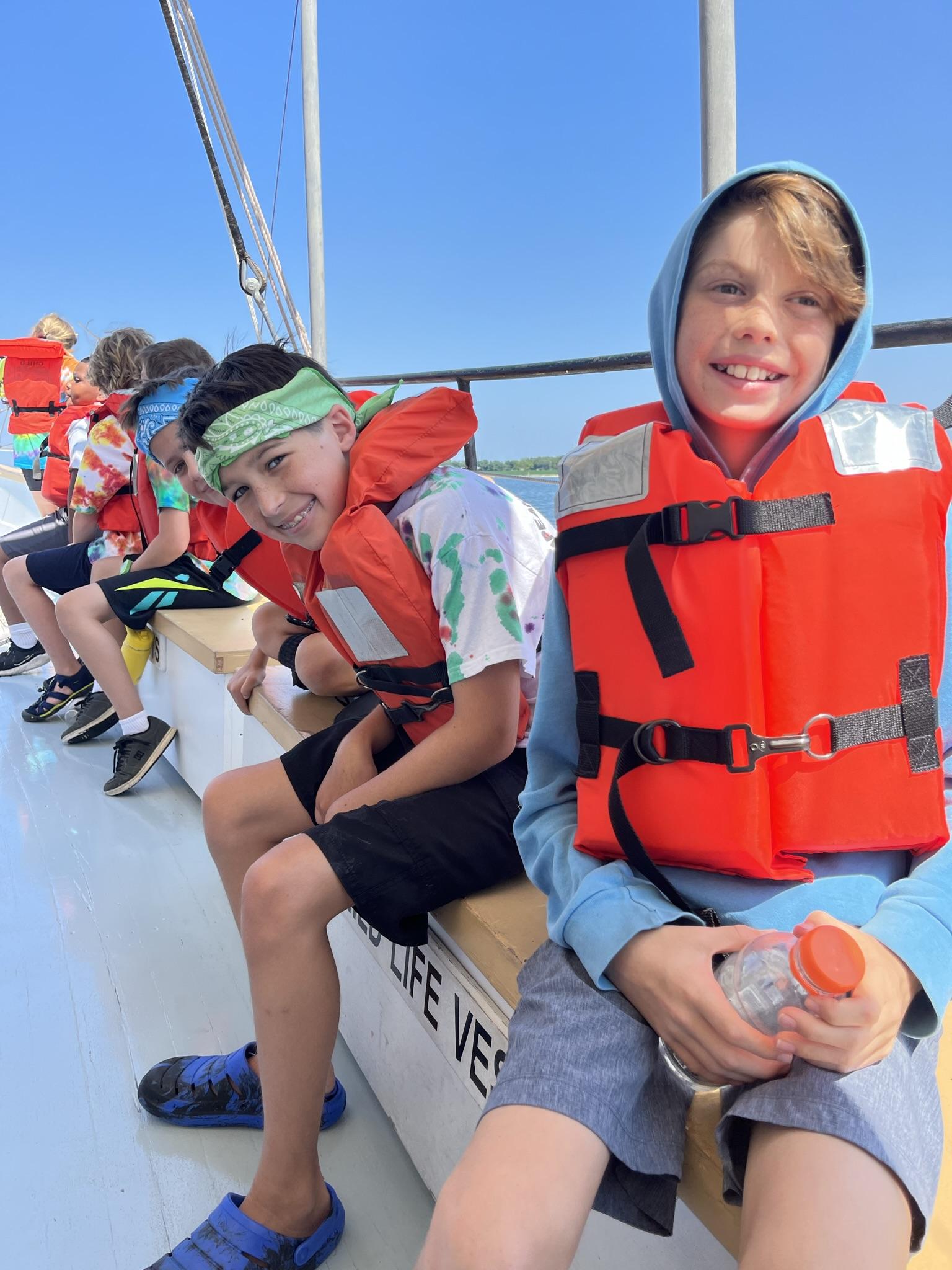 Calvert 4-H campers smiling on the boat