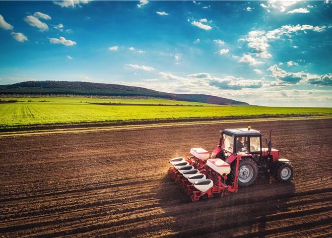 Tractor planting seed in the field