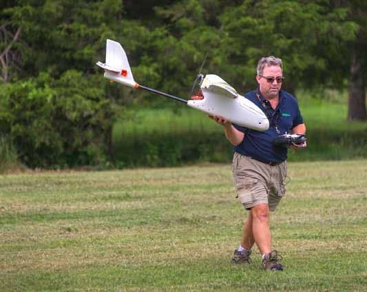 Man holding a drone. Photo: Edwin Remsberg