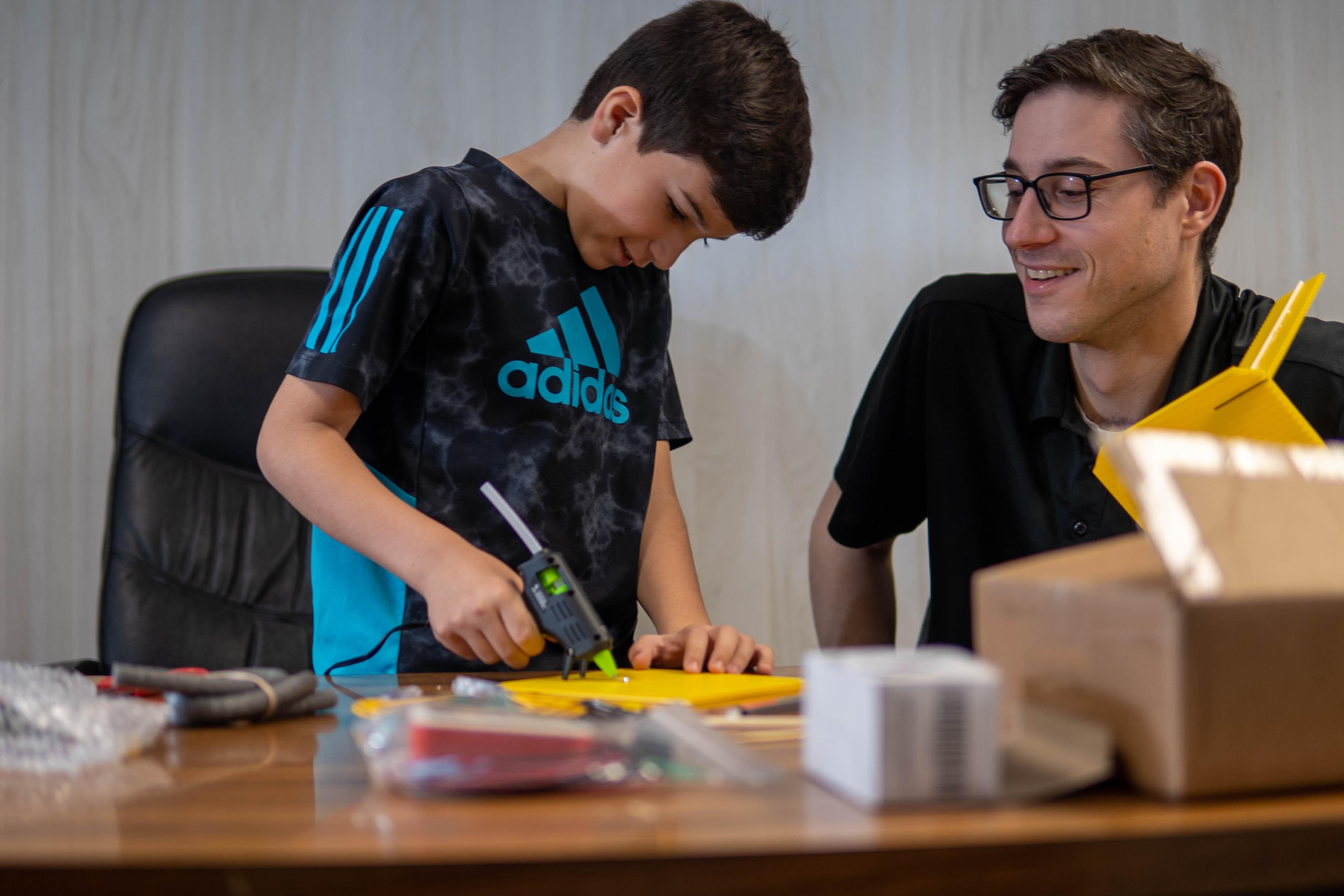 A child puts together a kit underwater ROV